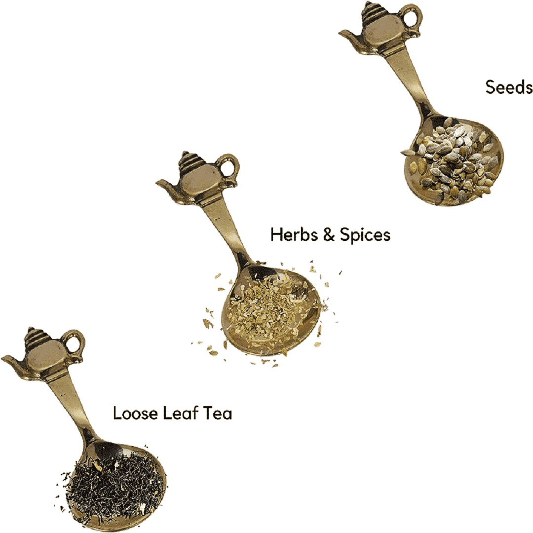 image of decorative brass teaspoon with kettle shape end containing tea seeds and herbs and spices